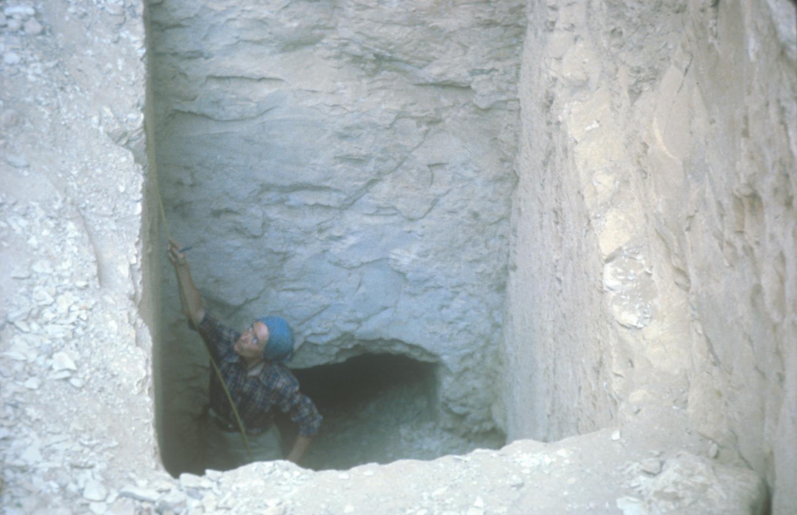 Catharine Roehrig surveying in tomb entryway.