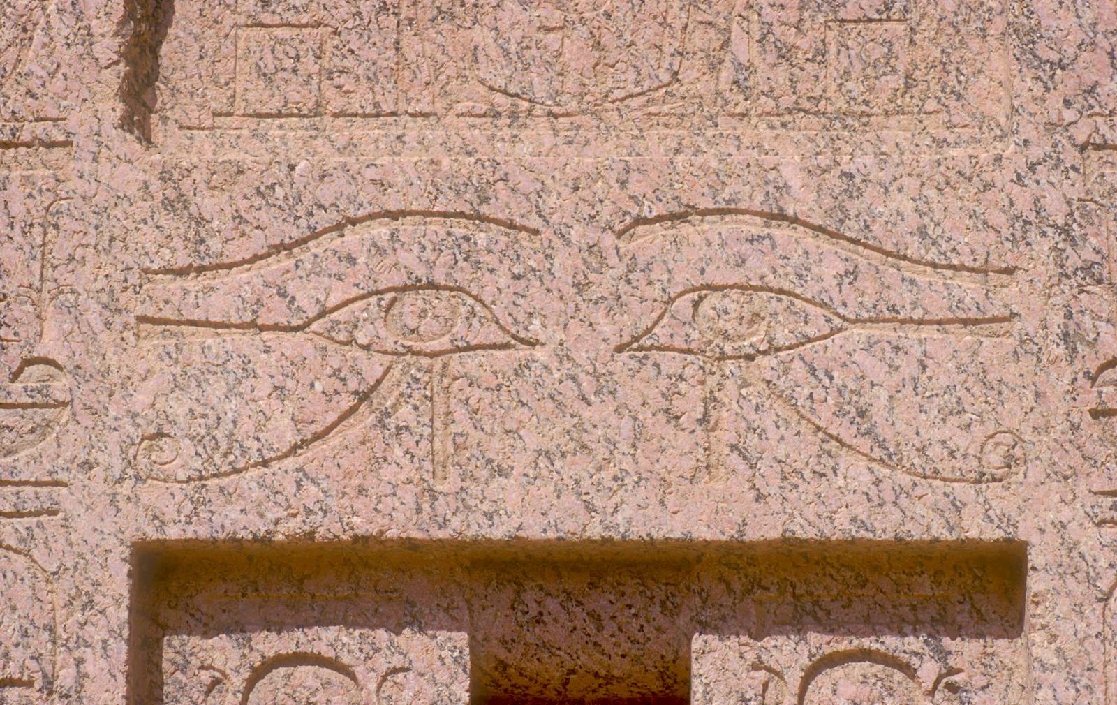 Madinat Habu, Roman forecourt of Amen temple, granite false door from Memorial temple of Thutmes III, detail: pair of Horus eyes